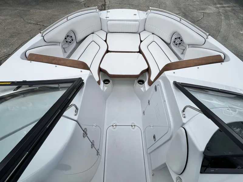 Slide: The Image of Interior view of 2026 Stingray 211DC boat, luxurious white seating. - 15
