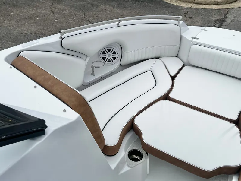 Slide: The Image of Luxurious seating in Stingray 211DC boat, 2026 model, available for $74,749. - 16
