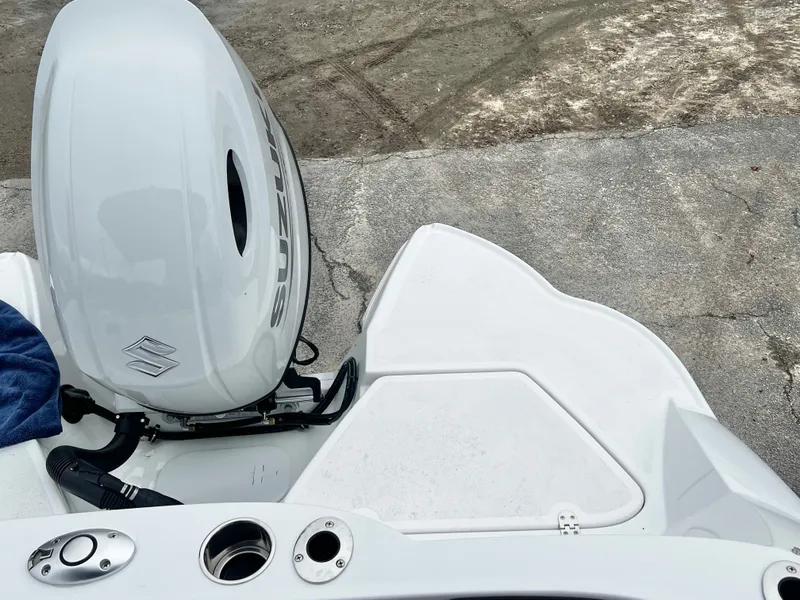 Slide: The Image of Suzuki outboard motor on a 2026 Stingray 211DC boat. - 22