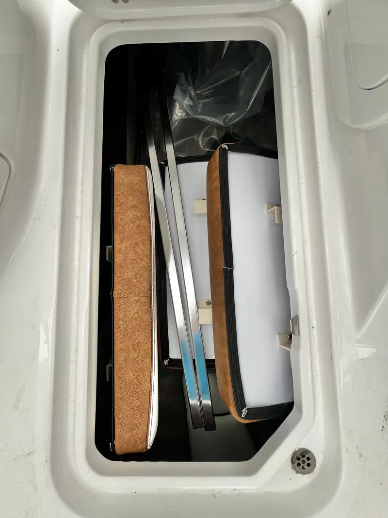 Slide: The Image of Stingray 211DC boat storage with cushions, 2026 model. - 25