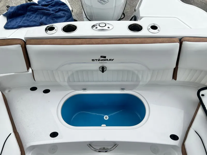 Slide: The Image of Stingray 211DC boat with blue basin, 2026 model. - 27