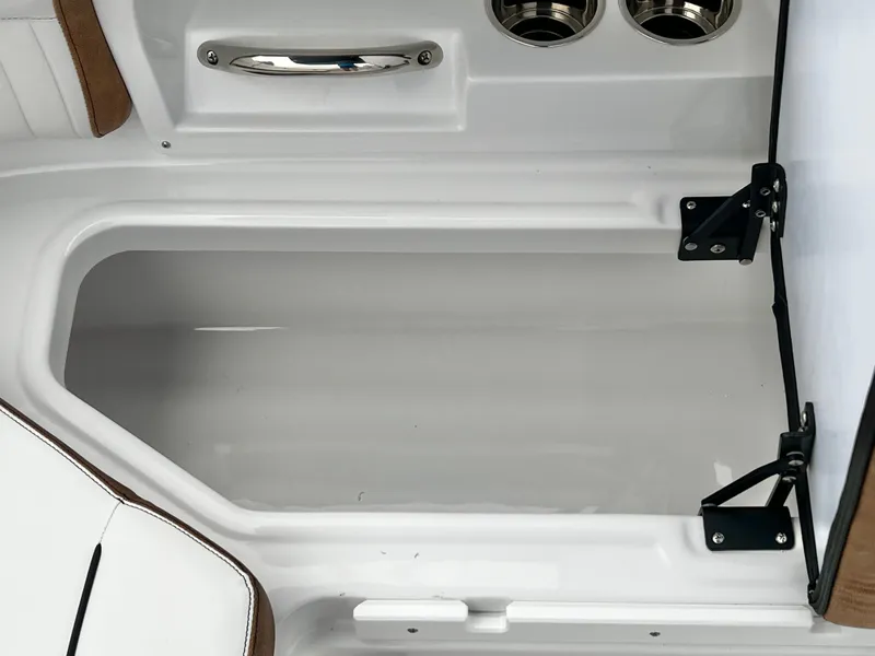 Slide: The Image of Interior of 2026 Stingray 211DC with storage and cup holders. - 30