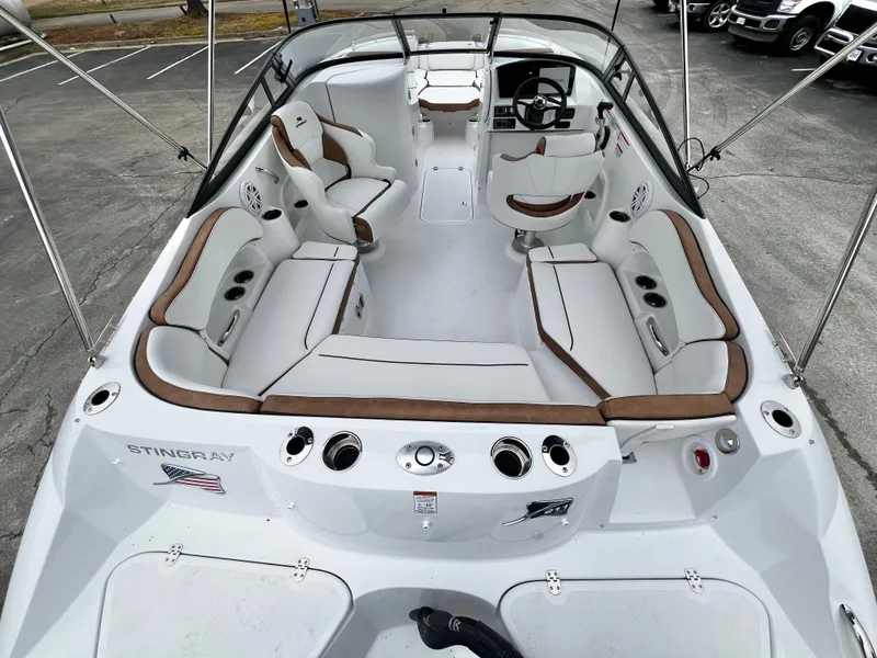 Slide: The Image of Interior view of 2026 Stingray 211DC boat, white with brown accents. - 8