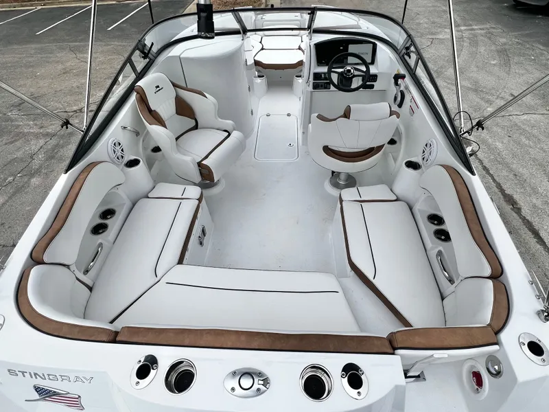 Slide: The Image of Interior view of 2026 Stingray 211DC boat, luxurious seating, in stock. - 9