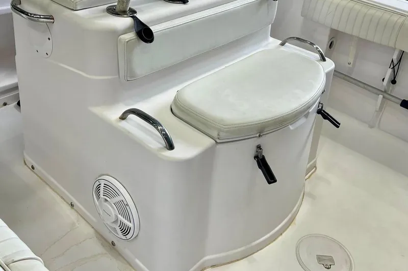 Slide: The Image of 2001 Pro-Line 25 Sport CC boat interior with seating and storage. - 14