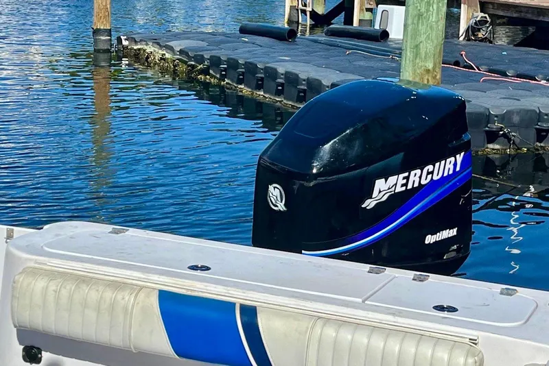 Slide: The Image of 2001 Pro-Line 25 Sport CC with Mercury OptiMax engine at dock. - 30