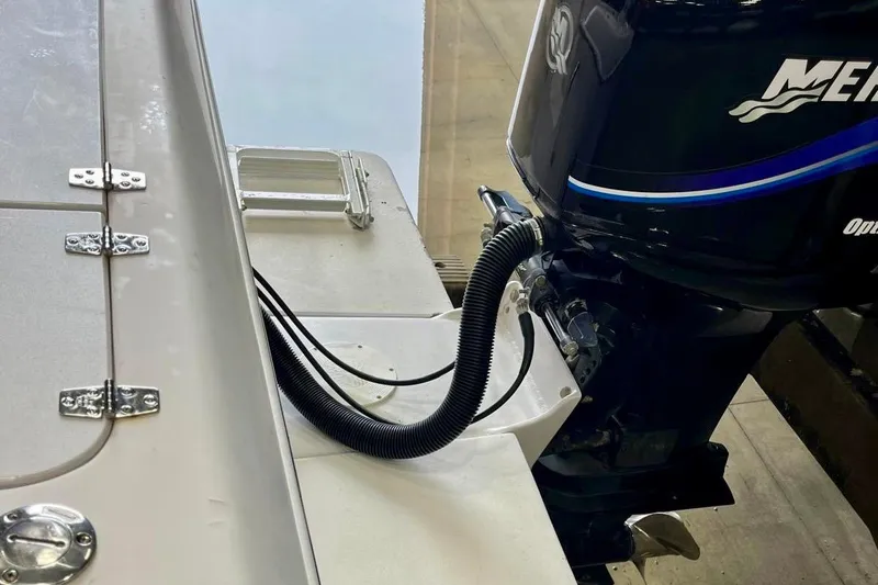 Slide: The Image of 2001 Pro-Line 25 Sport CC boat with Mercury outboard motor, close-up view. - 31