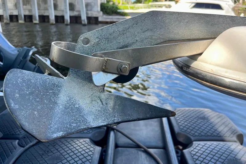 Slide: The Image of Anchor of 2001 Pro-Line 25 Sport CC boat near water. - 33