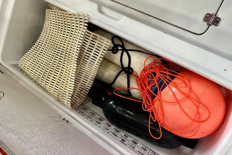 Slide: The Image of Storage compartment of 2001 Pro-Line 25 Sport CC with marine equipment and accessories. - 35