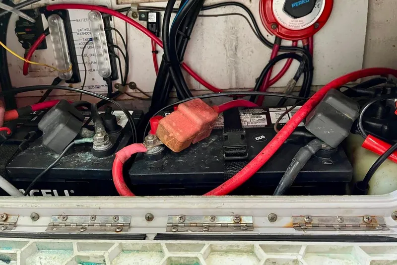 Slide: The Image of Battery compartment of a 2001 Pro-Line 25 Sport CC boat with wiring and connections. - 38