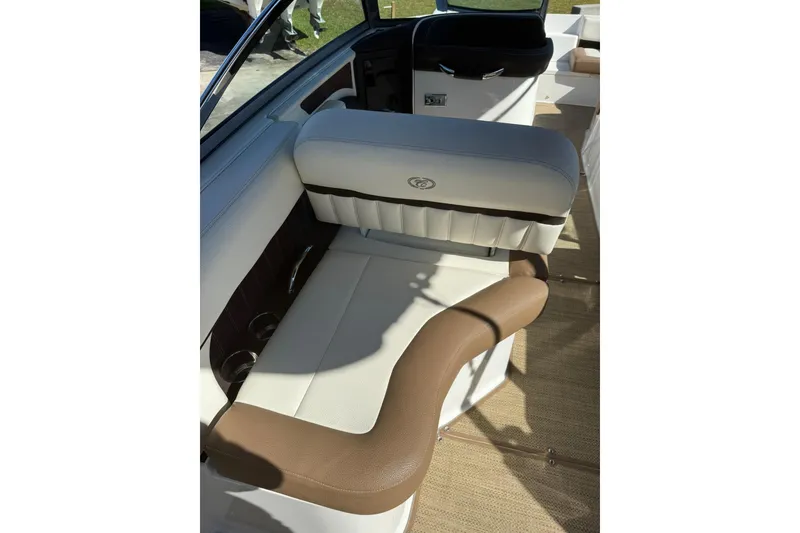 Slide: The Image of 2020 Cobalt 25SC boat interior with beige and white seating. - 15