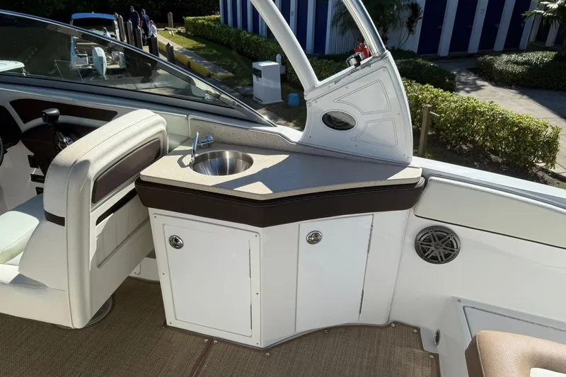 Slide: The Image of 2020 Cobalt 25SC boat interior with sink and seating area. - 17