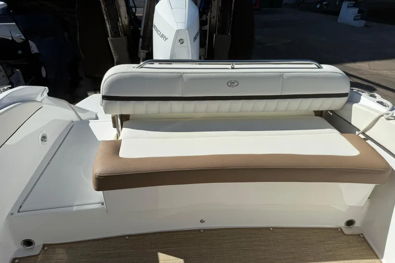 Slide: The Image of 2020 Cobalt 25SC boat with cushioned seating and Mercury outboard motor. - 18