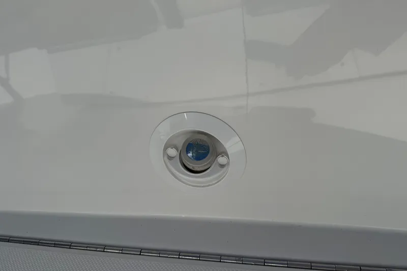 Slide: The Image of 2020 Cobalt 25SC boat detail showing a deck fitting on a white surface. - 21