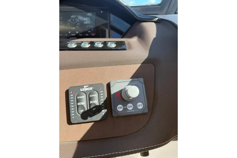 Slide: The Image of Control panel of a 2020 Cobalt 25SC boat with Lenco and Side-Power systems. - 4