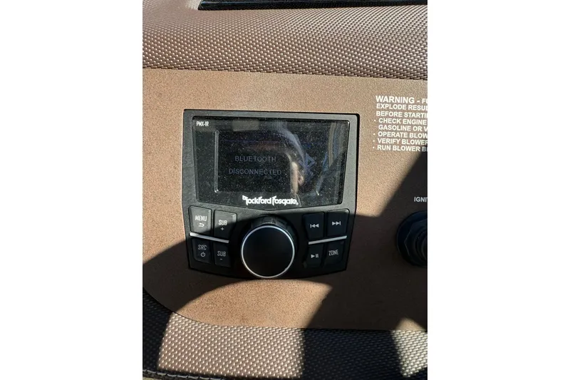 Slide: The Image of 2020 Cobalt 25SC boat dashboard with Rockford Fosgate audio system, Bluetooth disconnected. - 5