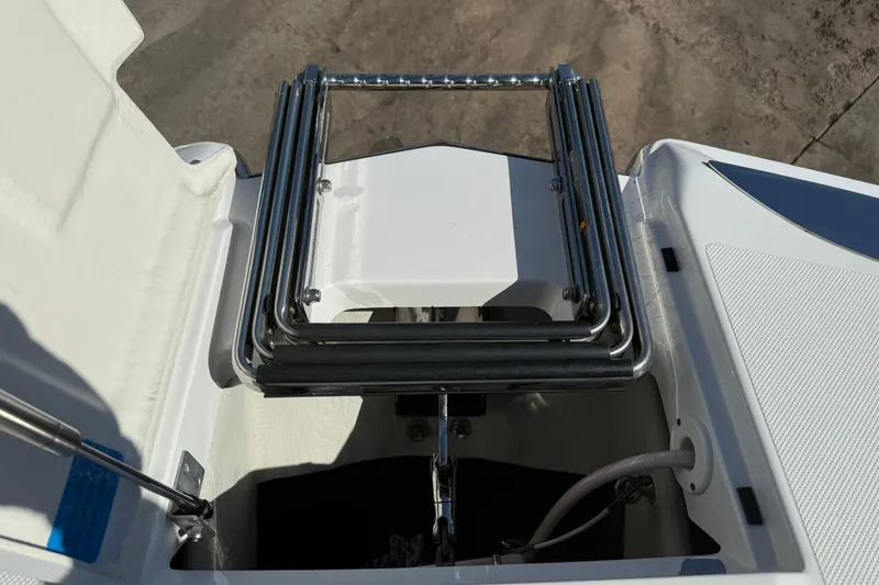 Slide: The Image of 2020 Cobalt 25SC boat ladder and storage compartment detail. - 7