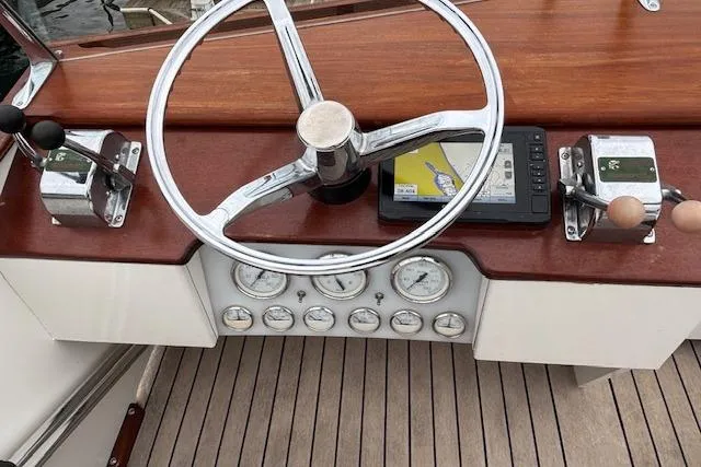 Slide: The Image of 1964 Pacemaker 36 Sportfisherman boat docked at a marina, viewed from the bow. - 11