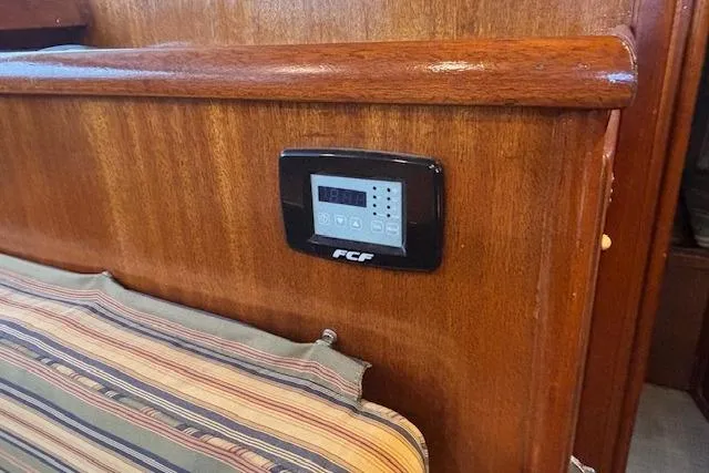 Slide: The Image of Interior of 1964 Pacemaker 36 Sportfisherman boat with wooden paneling and natural light. - 18