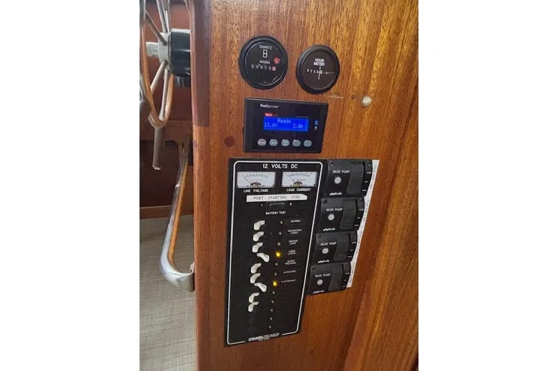 Slide: The Image of 1964 Pacemaker 36 Sportfisherman interior with wooden cabinetry and built-in stainless steel appliance. - 22