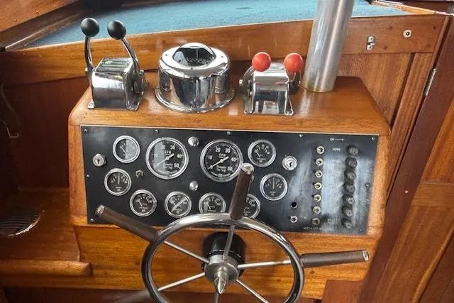 Slide: The Image of Control panel of a 1964 Pacemaker 36 Sportfisherman boat with gauges and switches. - 23