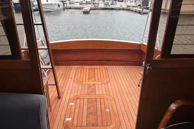 Slide: The Image of 1964 Pacemaker 36 Sportfisherman boat deck with wooden finish, docked at marina. - 26