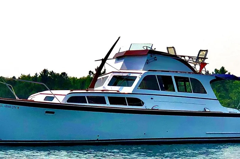 Slide: The Image of Interior of a 1964 Pacemaker 36 Sportfisherman boat with wooden helm and seating. - 3