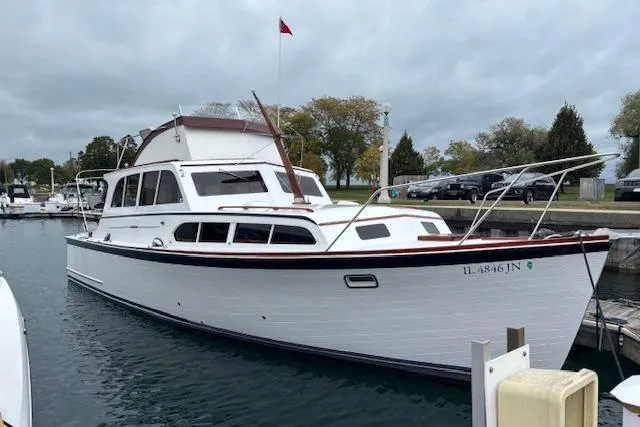 Slide: The Image of 1964 Pacemaker 36 Sportfisherman docked in urban marina with city skyline. - 7