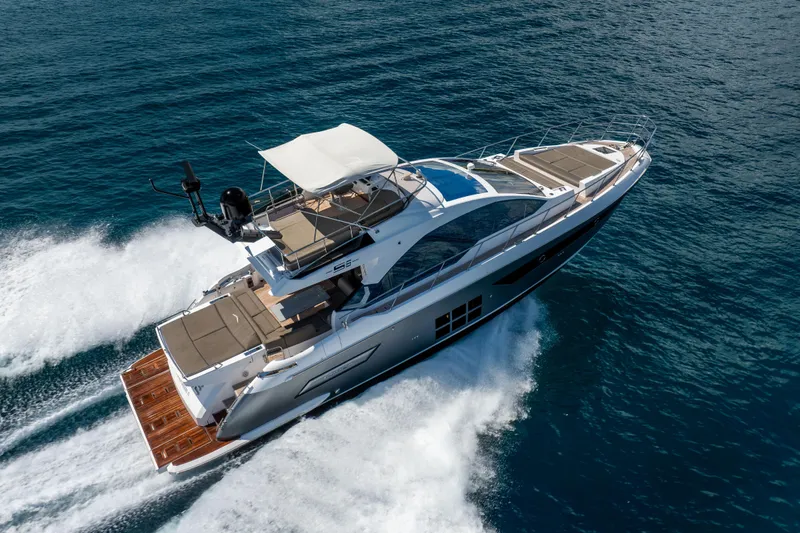 Slide: The Image of 2021 Azimut S6 Sportfly yacht cruising on open water, showcasing luxury design and speed. - 10