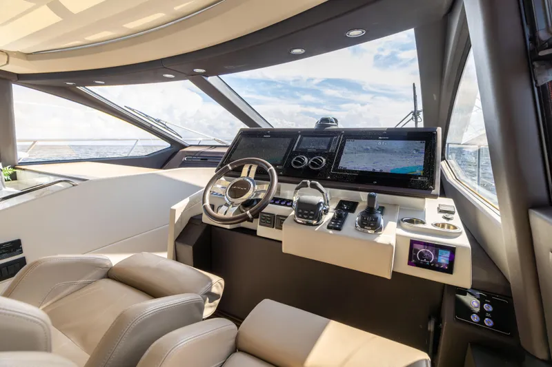 Slide: The Image of Cockpit of 2021 Azimut S6 Sportfly yacht with advanced navigation controls and displays. - 123