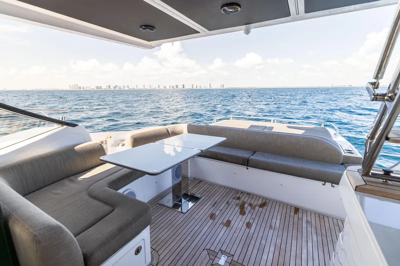Slide: The Image of Azimut S6 Sportfly 2021 yacht interior with ocean view and city skyline. - 139