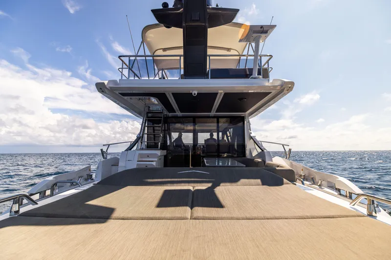 Slide: The Image of 2021 Azimut S6 Sportfly yacht with luxurious outdoor seating and ocean view. - 147