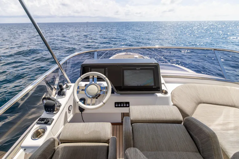 Slide: The Image of 2021 Azimut S6 Sportfly yacht helm with steering wheel and navigation controls. - 153