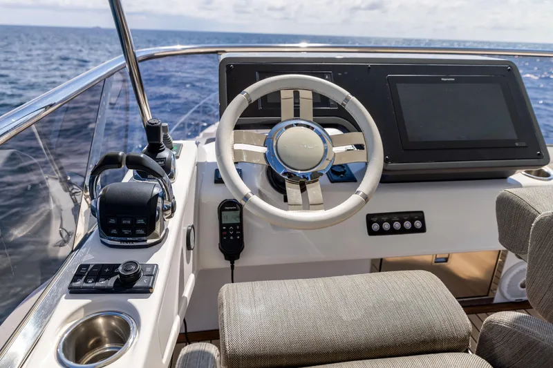 Slide: The Image of 2021 Azimut S6 Sportfly yacht deck with seating, ocean view, and canopy. - 154