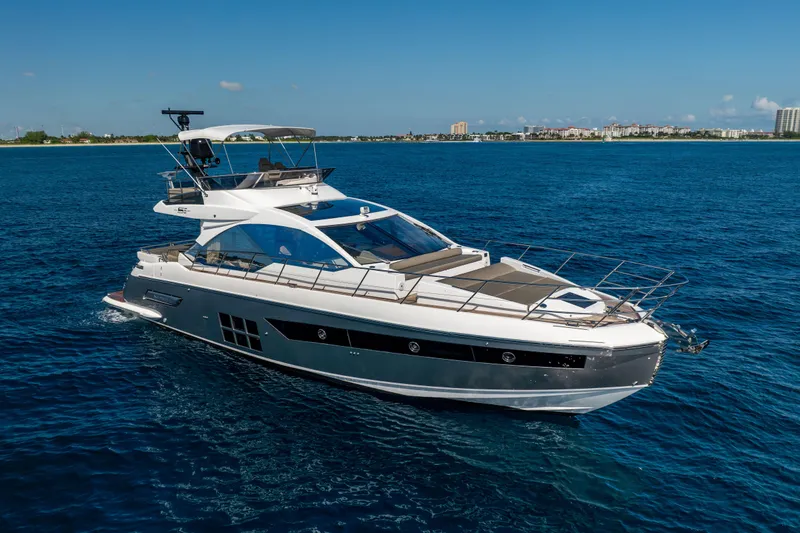 Slide: The Image of 2021 Azimut S6 Sportfly yacht cruising on open blue waters. - 16