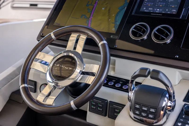 Slide: The Image of Control panel of 2021 Azimut S6 Sportfly yacht with digital display and cup holders. - 170