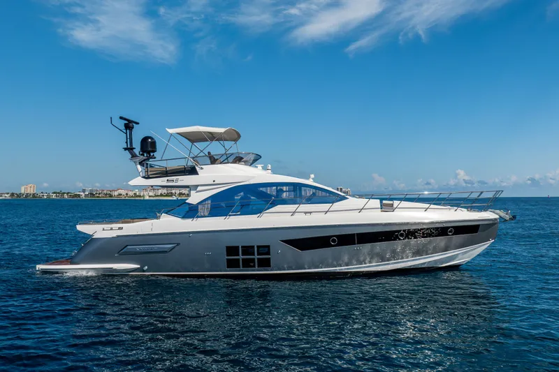 Slide: The Image of Azimut S6 Sportfly 2021 yacht cruising on open water under clear blue skies. - 18