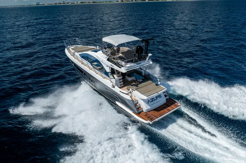 Slide: The Image of Azimut S6 Sportfly 2021 yacht cruising on open sea, aerial view. - 2