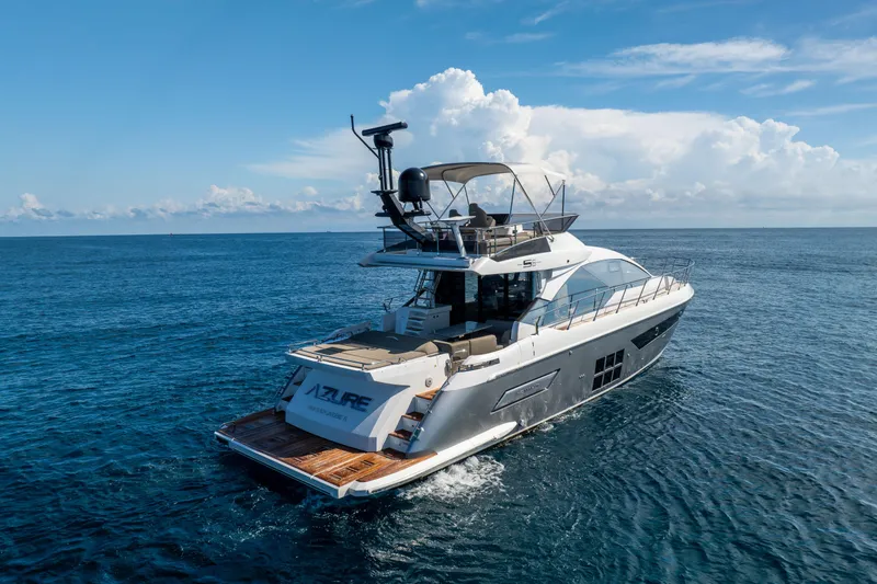 Slide: The Image of 2021 Azimut S6 Sportfly yacht cruising on open blue sea. - 21