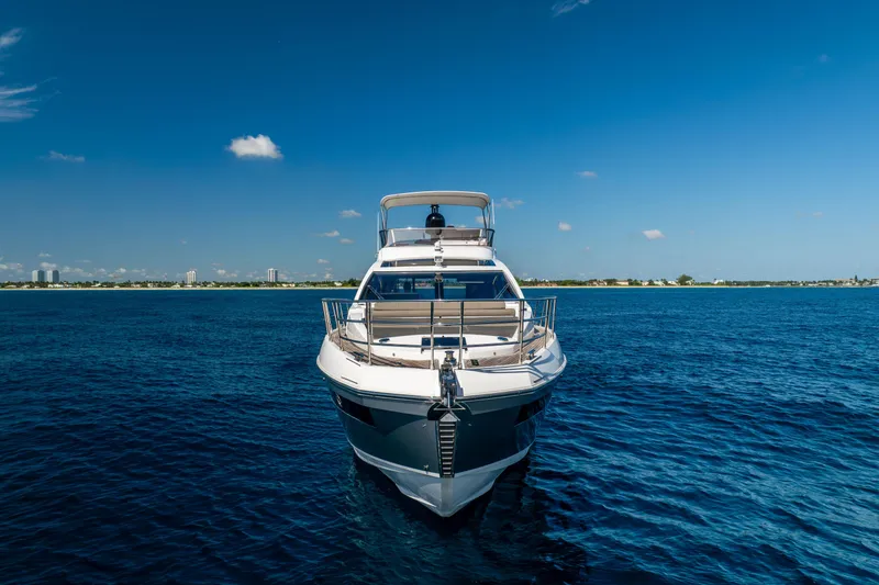 Slide: The Image of 2021 Azimut S6 Sportfly yacht cruising on open water under clear skies. - 27