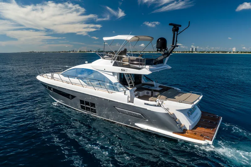 Slide: The Image of Luxurious 2021 Azimut S6 Sportfly yacht cruising on open blue waters. - 30