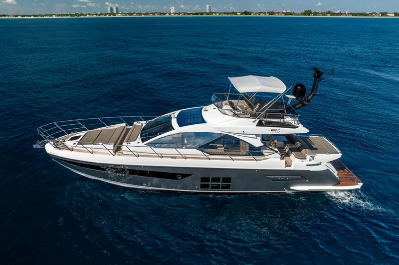 Slide: The Image of 2021 Azimut S6 Sportfly yacht cruising on open blue sea under clear sky. - 33