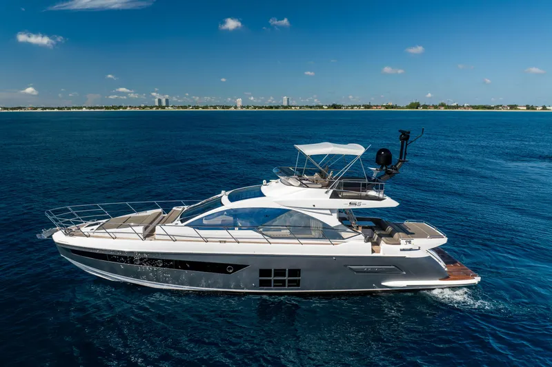 Slide: The Image of 2021 Azimut S6 Sportfly yacht cruising on open blue sea under clear sky. - 34
