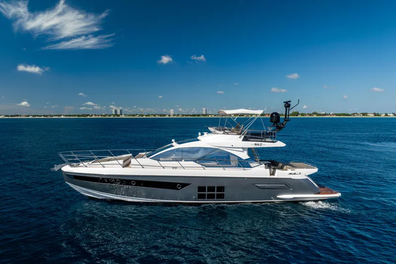 Slide: The Image of 2021 Azimut S6 Sportfly yacht cruising on a clear blue ocean under a sunny sky. - 35