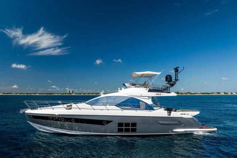 Slide: The Image of 2021 Azimut S6 Sportfly yacht cruising on open water under clear blue skies. - 36