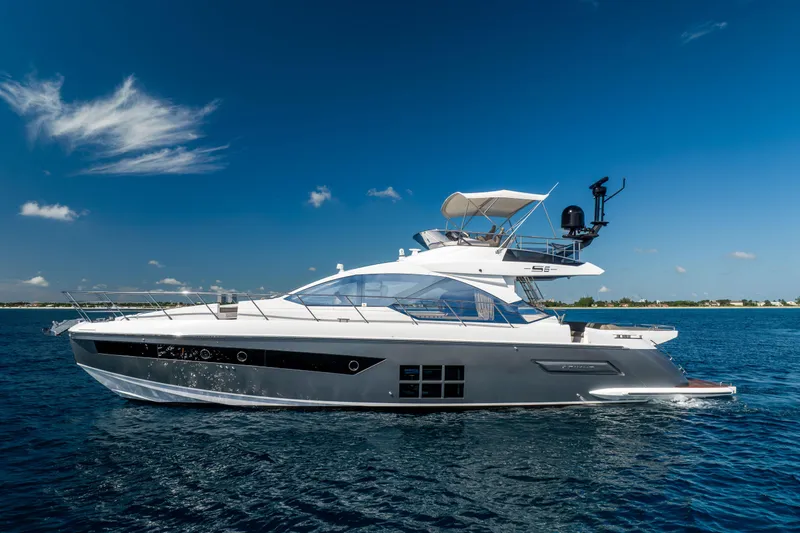 Slide: The Image of 2021 Azimut S6 Sportfly yacht cruising on open water under clear blue sky. - 37