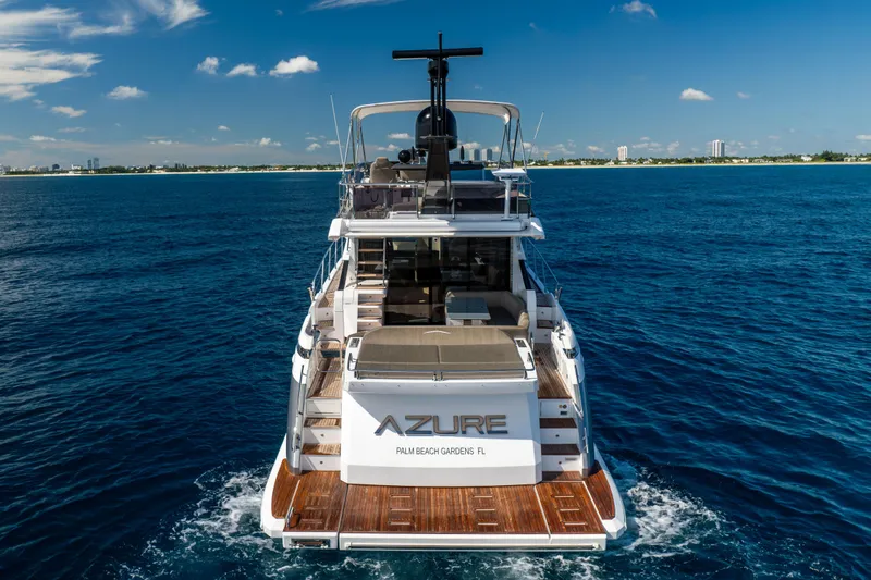 Slide: The Image of 2021 Azimut S6 Sportfly yacht cruising on open water under a clear blue sky. - 42