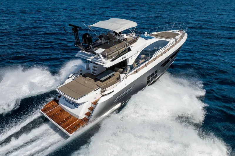 Slide: The Image of Azimut S6 Sportfly 2021 yacht cruising on open sea, aerial rear view. - 46