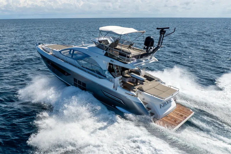 Slide: The Image of 2021 Azimut S6 Sportfly yacht cruising on open sea under clear skies. - 49