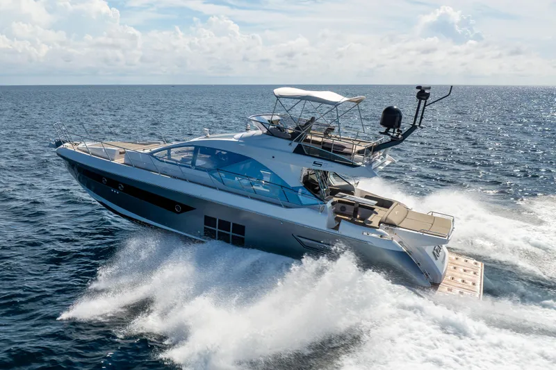 Slide: The Image of 2021 Azimut S6 Sportfly yacht cruising on open sea under clear skies. - 50